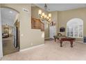 Spacious game room with a pool table and staircase, ideal for entertainment and Gathering gatherings at 3859 N El Sereno St, Mesa, AZ 85207