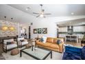 Inviting living room with comfortable seating, stylish decor, and an open flow to the kitchen and dining area at 4124 E Indianola Ave, Phoenix, AZ 85018