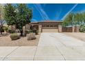 Charming single-story home with desert landscaping, driveway, and a two-car garage at 5232 N 186Th Dr, Litchfield Park, AZ 85340