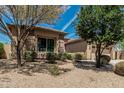 Charming single-story home with desert landscaping, and a two-car garage at 5232 N 186Th Dr, Litchfield Park, AZ 85340