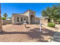 Beautiful single-story home showcasing desert landscaping, decorative fountain, and covered entryway at 709 E Dry Creek Rd, San Tan Valley, AZ 85143