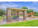 Community playground features a shaded picnic area and colorful play structure with a slide at 742 E Kyle Dr, Gilbert, AZ 85296