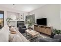 Cozy living area featuring a fireplace, a modern TV setup, and lots of natural light at 7887 N 16Th St # 224, Phoenix, AZ 85020