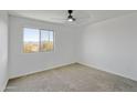 Bright, empty bedroom with large windows and neutral carpet at 8137 W Pueblo Ave, Phoenix, AZ 85043