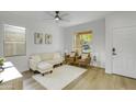 Comfortable living room with natural light and modern furnishings at 8137 W Pueblo Ave, Phoenix, AZ 85043