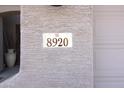 Close-up of house number '8920' on the exterior wall next to the garage at 8920 S 40Th Ln, Laveen, AZ 85339