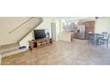 Open-concept living space with tile floors, adjacent to a modern kitchen with stainless steel appliances, great for entertaining at 14620 N Yerba Buena Way # B, Fountain Hills, AZ 85268