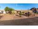 Charming single-story home featuring desert landscaping and a well-maintained exterior at 2319 N 58Th St, Scottsdale, AZ 85257