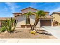 Beautiful two-story home with desert landscaping, including palm trees and cacti at 2460 E Crescent Way, Gilbert, AZ 85298