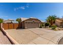 Single-story house with desert landscaping, a two-car garage, and neutral exterior at 24813 N 55Th Dr, Glendale, AZ 85310