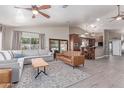Spacious living room featuring hardwood floors, stylish furniture, and lots of natural light at 24813 N 55Th Dr, Glendale, AZ 85310
