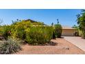 Single story home with gravel landscaping and partial driveway view at 2716 S Terrace Rd, Tempe, AZ 85282