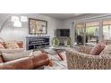 Cozy living room with a glass coffee table and sliding door to patio at 2716 S Terrace Rd, Tempe, AZ 85282