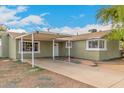 This single-story home has a carport and a front entryway at 3802 N 50Th Ave, Phoenix, AZ 85031