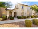Inviting home exterior with stucco finish, a balcony, and a beautifully landscaped front yard at 3910 E Turley St, Gilbert, AZ 85295