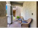 Cozy covered porch with wicker chairs, offering a relaxing outdoor space at 3910 E Turley St, Gilbert, AZ 85295
