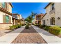 Scenic street view of homes with manicured landscapes and inviting walkways at 3910 E Turley St, Gilbert, AZ 85295