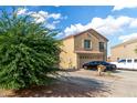 Two story house with desert landscaping, a two-car garage and neutral colored stucco exterior at 42758 W Camino De Janos --, Maricopa, AZ 85138