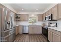 Bright kitchen featuring stainless steel appliances, white countertops, and plenty of cabinet space for storage at 4325 W Sierra St, Glendale, AZ 85304