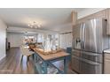 Well-lit kitchen featuring stainless steel appliances, modern cabinetry, and an adjacent dining area for easy living at 4325 W Sierra St, Glendale, AZ 85304