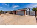 Lovely home with a two car garage, desert landscaping, and a long driveway at 5721 W Palo Verde Ave, Glendale, AZ 85302
