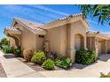 Side view of charming single-story home featuring desert landscape at 5830 E Mckellips Rd # 120, Mesa, AZ 85215