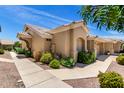 Side view of charming single-story home featuring desert landscape at 5830 E Mckellips Rd # 120, Mesa, AZ 85215