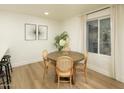 Bright dining area features modern furnishings and a large window with natural light at 628 N Hobson --, Mesa, AZ 85203