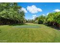 Lush backyard with manicured lawn and putting green at 6624 N 66Th N Pl, Paradise Valley, AZ 85253