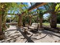 Outdoor patio with pergola, ceiling fan, and comfortable seating area at 6624 N 66Th N Pl, Paradise Valley, AZ 85253