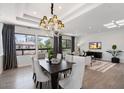 Bright living room with recessed lights, wood floors, black accents, and large windows at 7222 E Gainey Ranch Rd # 241, Scottsdale, AZ 85258
