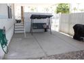 A covered outdoor patio features a porch swing for relaxing and stairs to access the home at 7807 E Main St # G-23, Mesa, AZ 85207