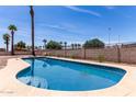 Sparkling blue backyard pool featuring steps and a stone-look deck, perfect for relaxing and entertaining at 8124 N 45Th Ave, Glendale, AZ 85302