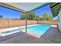 Inviting backyard featuring a refreshing swimming pool with a diving board, perfect for relaxation at 8326 E Valley View Rd, Scottsdale, AZ 85250