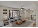 Comfortable living room features a gray sofa, wood coffee table and neutral decor at 8326 E Valley View Rd, Scottsdale, AZ 85250