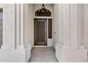 A stylish front door set between decorative white columns under an elegant light fixture at 896 N Kingston St, Gilbert, AZ 85233