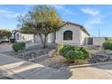 Attractive single-story home with desert landscaping, a wide driveway, and a covered front entrance at 896 N Kingston St, Gilbert, AZ 85233