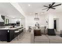 Open-concept living space with modern kitchen, dining area, and comfortable seating at 1304 W Ocotillo Rd, Phoenix, AZ 85013