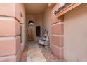 Inviting entryway features a decorative fountain, tile flooring, and solid wood front door at 15809 S 31St St, Phoenix, AZ 85048