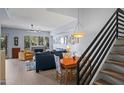 Bright and spacious living room with hardwood floors, fireplace and stairs to 2nd story at 17 W Vernon Ave # 31, Phoenix, AZ 85003