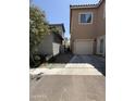 Side exterior view of garage and walkway with partial view of neighboring home at 1725 W Pollack St, Phoenix, AZ 85041