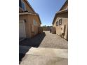 View of two tan homes and back yard of neighboring home at 1725 W Pollack St, Phoenix, AZ 85041