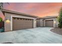 A three car garage with concrete driveway provides plenty of parking at 22323 E Via Del Jardin --, Queen Creek, AZ 85142