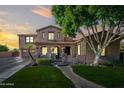 Charming two-story home boasts a landscaped front yard and a welcoming entrance with arched detailing at 2282 E Zion Way, Chandler, AZ 85249