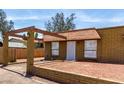 Single-story home with mature trees and an inviting covered entryway at 2333 W Glenrosa W Ave # 113, Phoenix, AZ 85015
