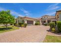 Stunning one-story home featuring a tile roof, lush landscaping, and paved driveway at 2457 E Melrose St, Mesa, AZ 85213