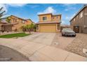 View of a two-story home with desert landscaping, palm trees, and a two-car garage at 25806 W Hilton Ave, Buckeye, AZ 85326