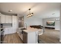 Spacious living room and kitchen combo, featuring a large island, stainless steel appliances, and an open layout for entertaining at 2604 N 27Th St # 4, Phoenix, AZ 85008