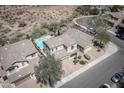 Stunning aerial view of a desert home featuring a sparkling blue pool and spacious backyard oasis at 29110 N 24Th Ln, Phoenix, AZ 85085