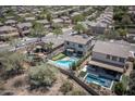 Overhead view of a property highlighting a pool, putting green, and outdoor entertainment area at 29110 N 24Th Ln, Phoenix, AZ 85085